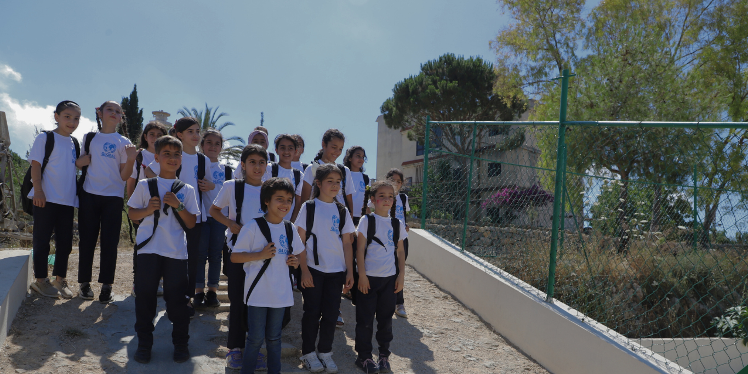 children wearing GRF t shirts and rucksacks