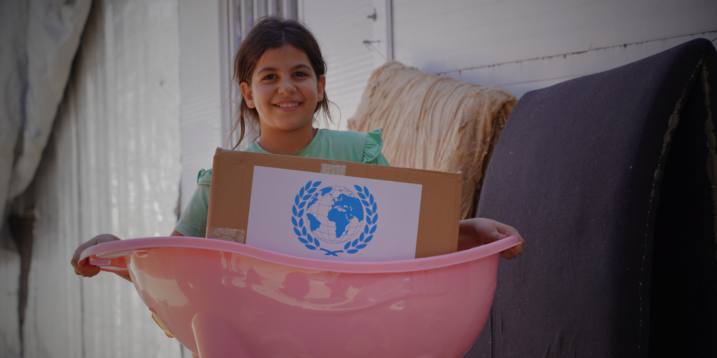 child holding GRF mother and baby kit