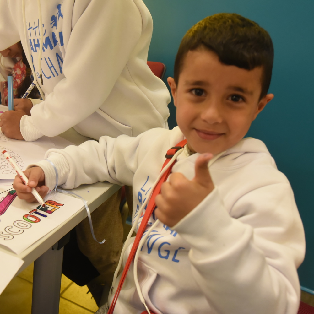child with thumbs up GRF