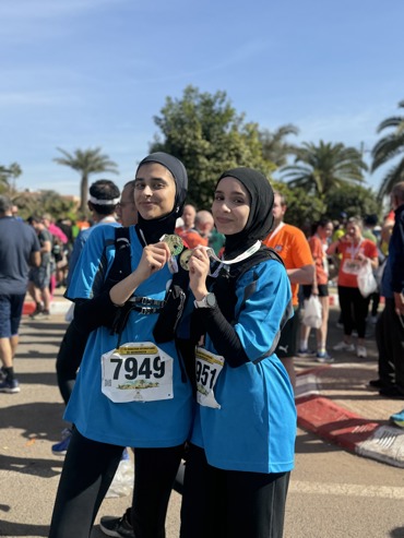 GRF holding medals after marathon